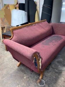Couch showing extreme signs of damage